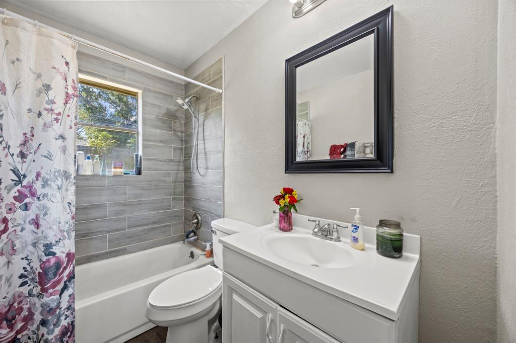 4812 Marshall Street Forest Hill, TX 76119 - Photo 7 of 10 a bathroom with a sink toilet and shower