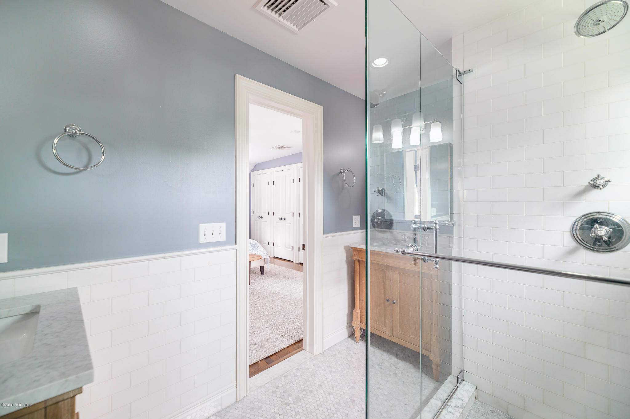 20 Meadow Road Riverside, CT 06878 - Photo 12 of 23 a bathroom with a glass shower door and a sink