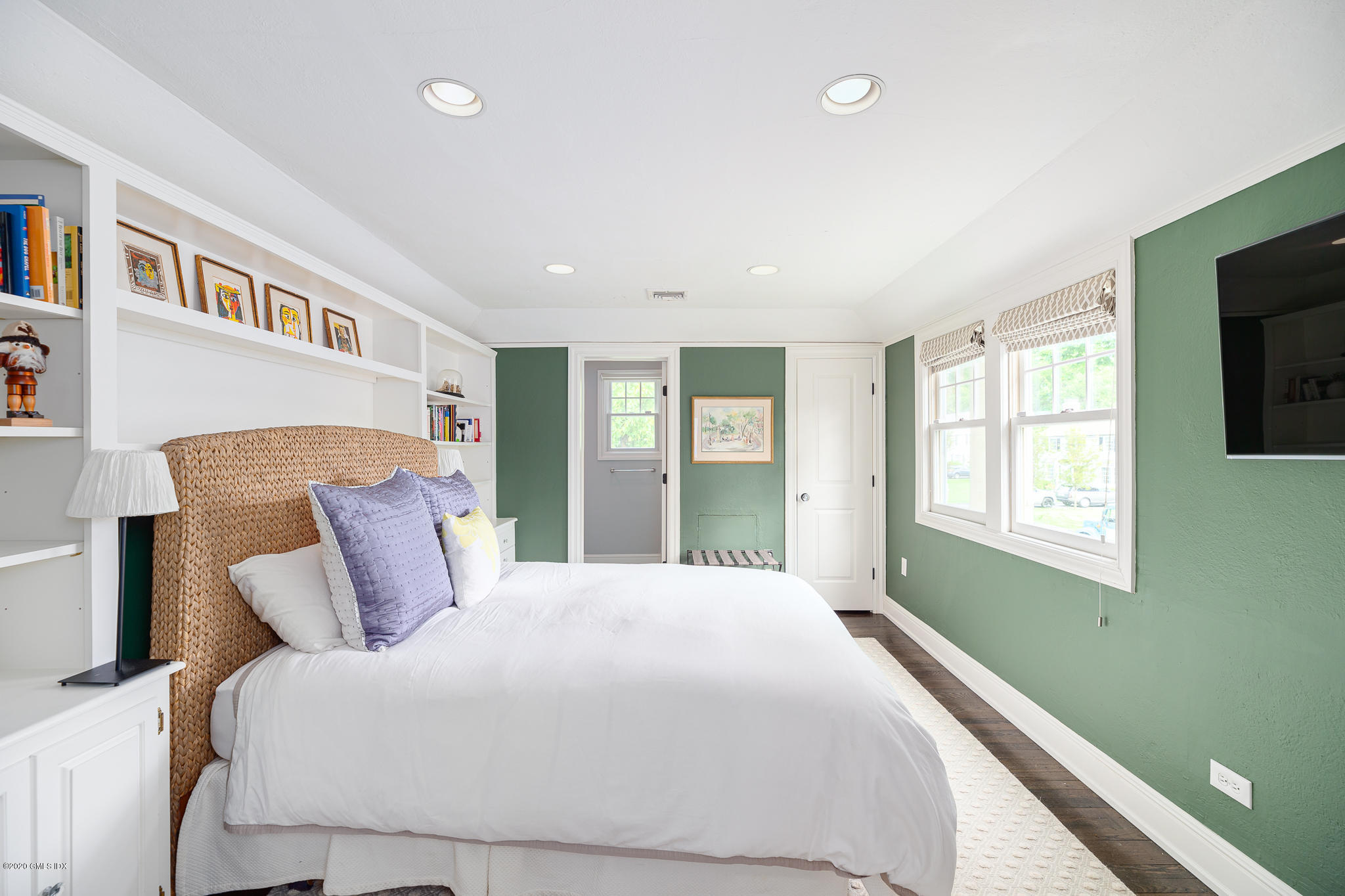 20 Meadow Road Riverside, CT 06878 - Photo 15 of 23 a bedroom with a large bed and a flat tv screen