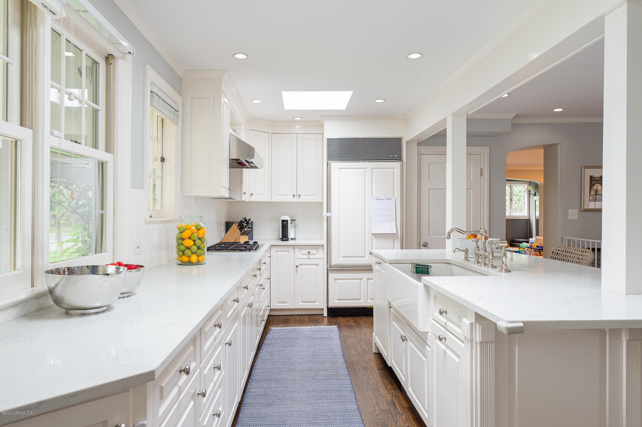 20 Meadow Road Riverside, CT 06878 - Photo 5 of 23 a kitchen that has a lot of white cabinets and wooden floor