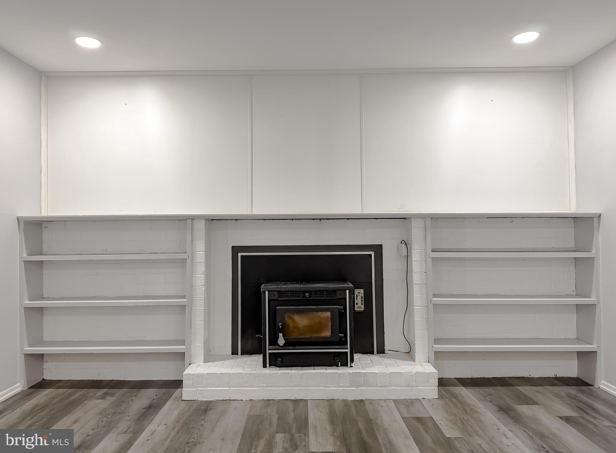 2419 Pinefield Road Waldorf, MD 20601 - Photo 13 of 29 Electric Pellet Stove and Built in Shelving