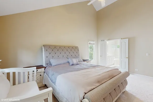 a bedroom with a bed and a couch