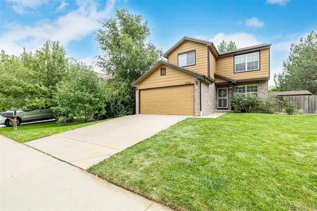 a small white house with a outdoor space