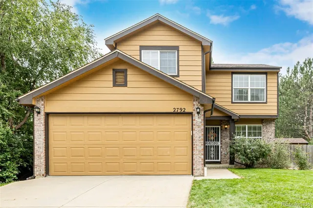 a front view of a house with yard