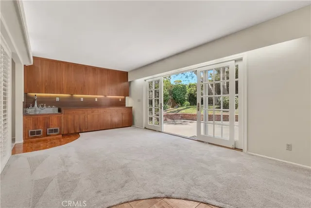 a view of an empty room with a fireplace