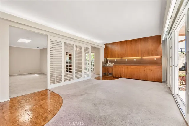 a front view of a house with a garden and yard