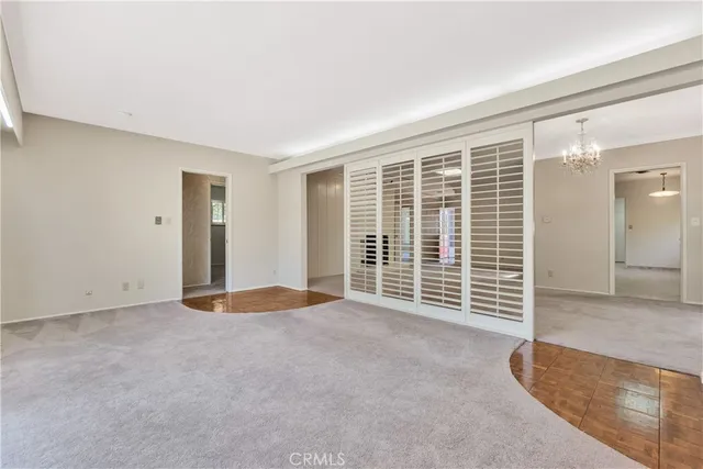 a view of a house with a backyard and a tree