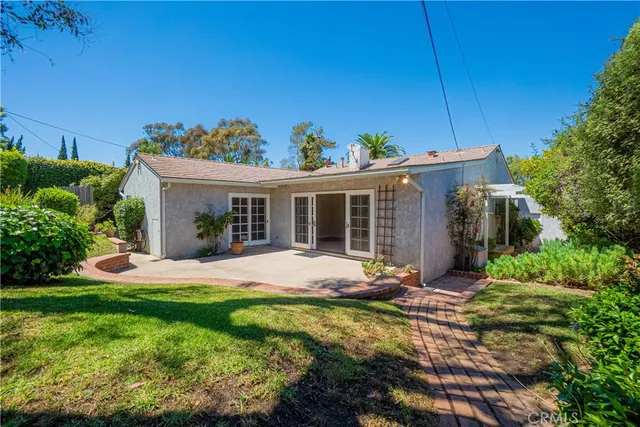a view of yard with patio