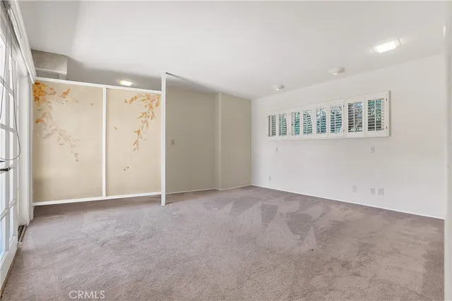 a bathroom with a granite countertop toilet sink and mirror
