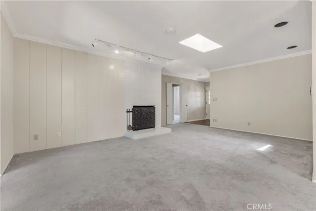 a view of an empty room with a cabinet