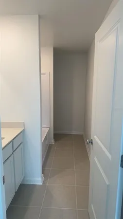 a view of cabinets and utility room in empty room