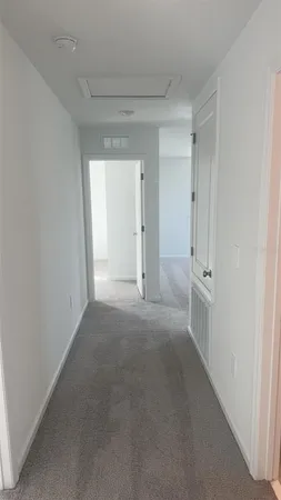 a view of a closet and chandelier fan in a room