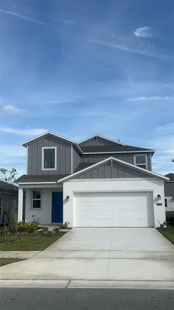 a view of a car parked in front of house