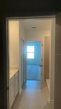 a kitchen with stainless steel appliances a refrigerator and a stove top oven