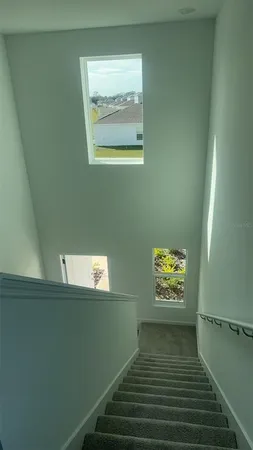 a view of an empty room and a window