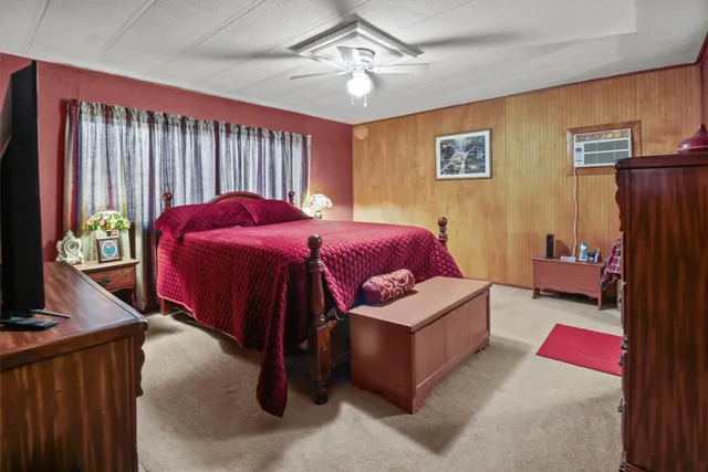 a spacious bedroom with a bed and a couch