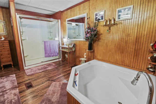 a bathroom with a bathtub and shower