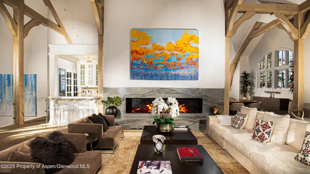 a dining room with furniture and a window