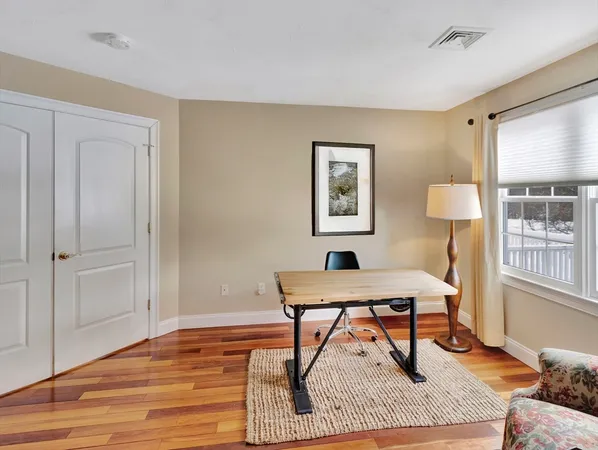 a workspace with furniture and window