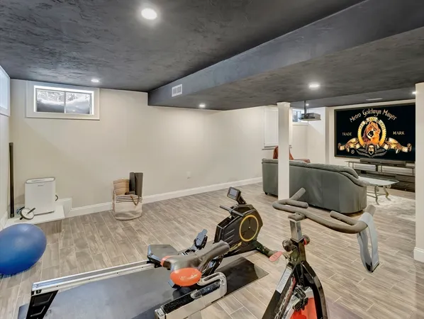 a room with furniture and air hockey table