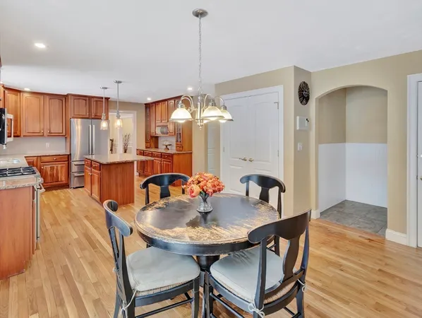 a kitchen with a table and chairs in it