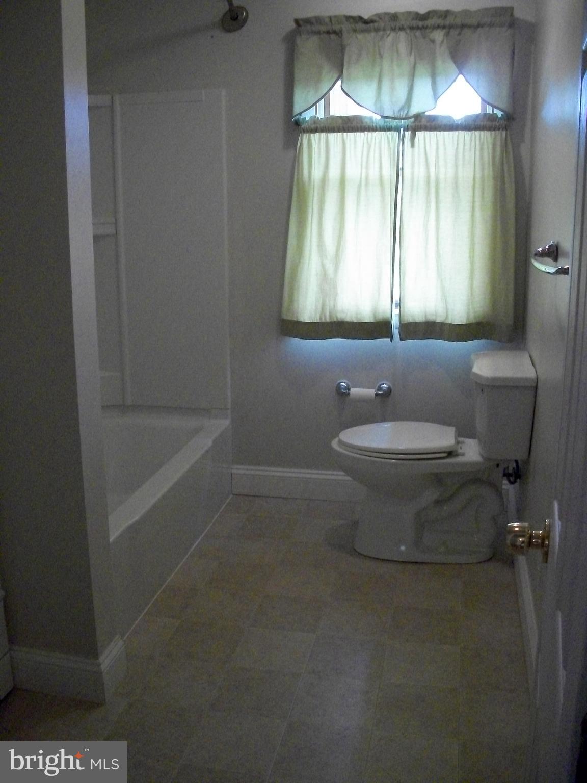 1102 Prospect Mill Road Bel Air, MD 21015 - Photo 16 of 18 a bathroom with a sink toilet and shower