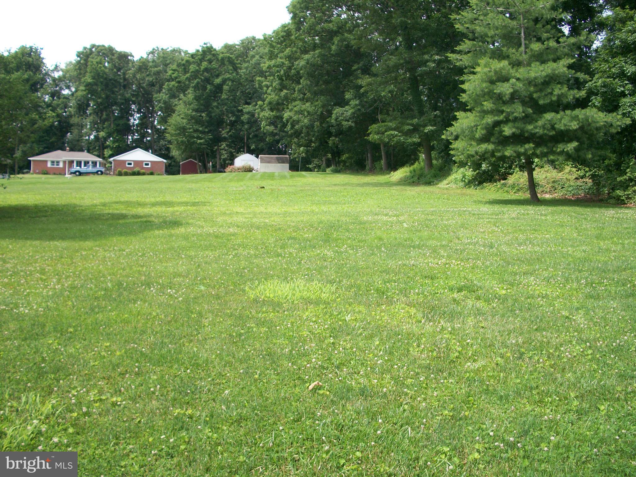 1102 Prospect Mill Road Bel Air, MD 21015 - Photo 3 of 18 a view of a grassy field with trees
