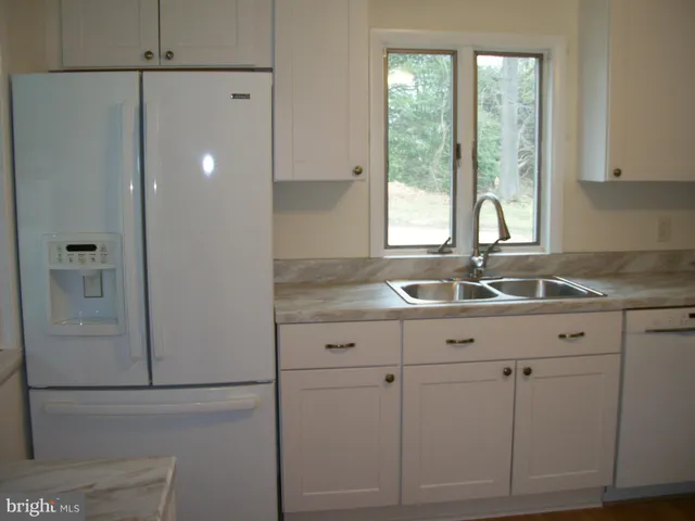 a bathroom with a sink and mirror