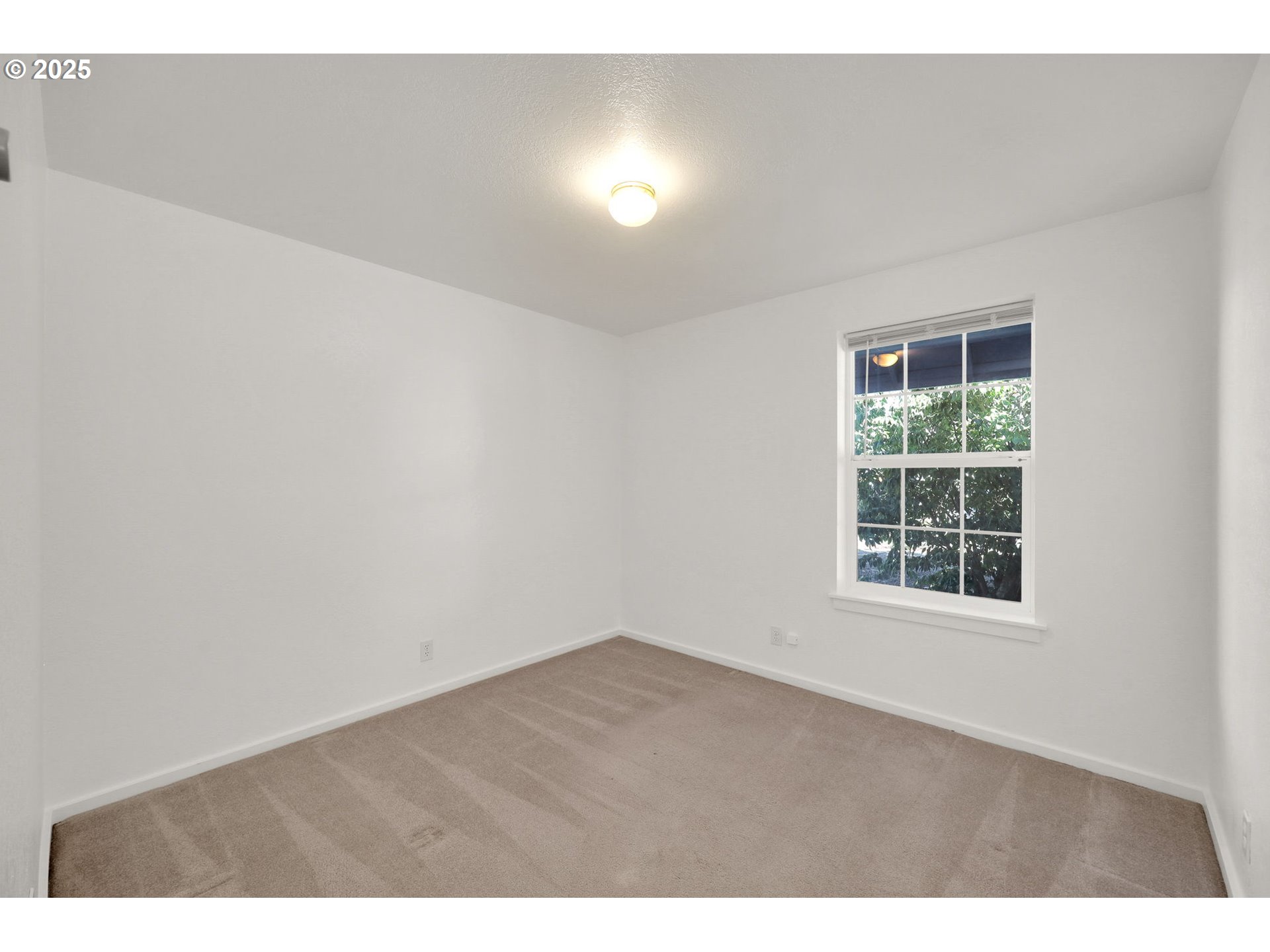 176 19th Street Springfield, OR 97477 - Photo 19 of 35 a view of an empty room with a window