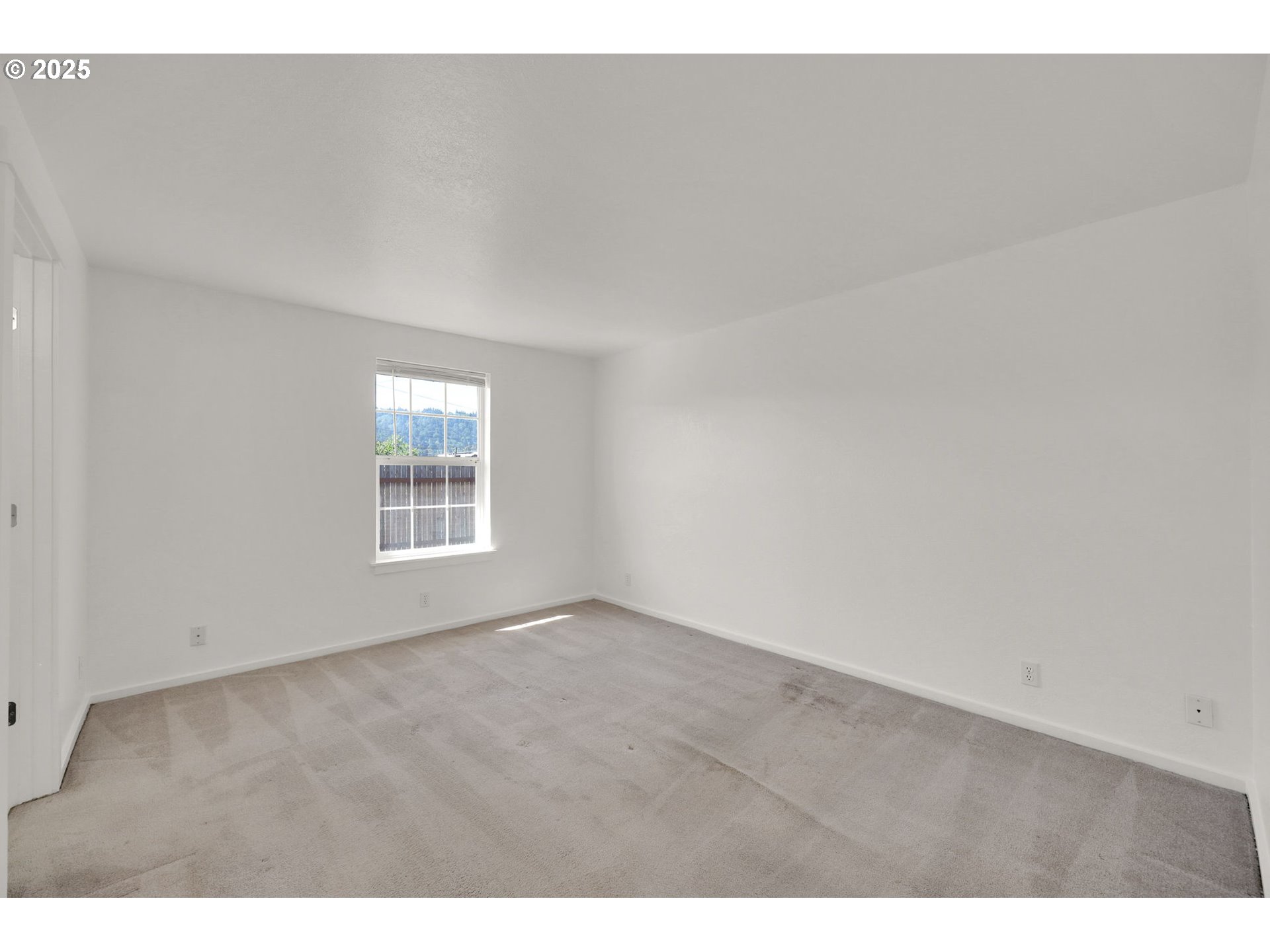 176 19th Street Springfield, OR 97477 - Photo 24 of 35 a view of an empty room with a window