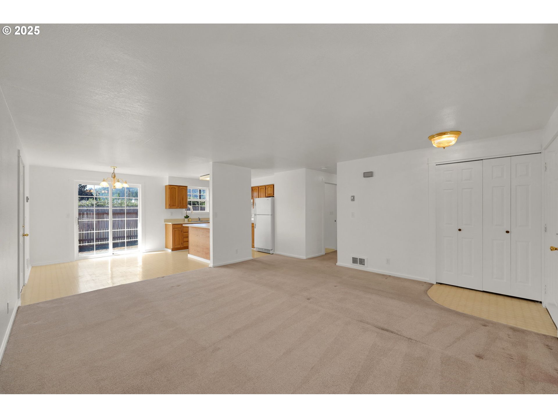 176 19th Street Springfield, OR 97477 - Photo 8 of 35 a view of an empty room with a window