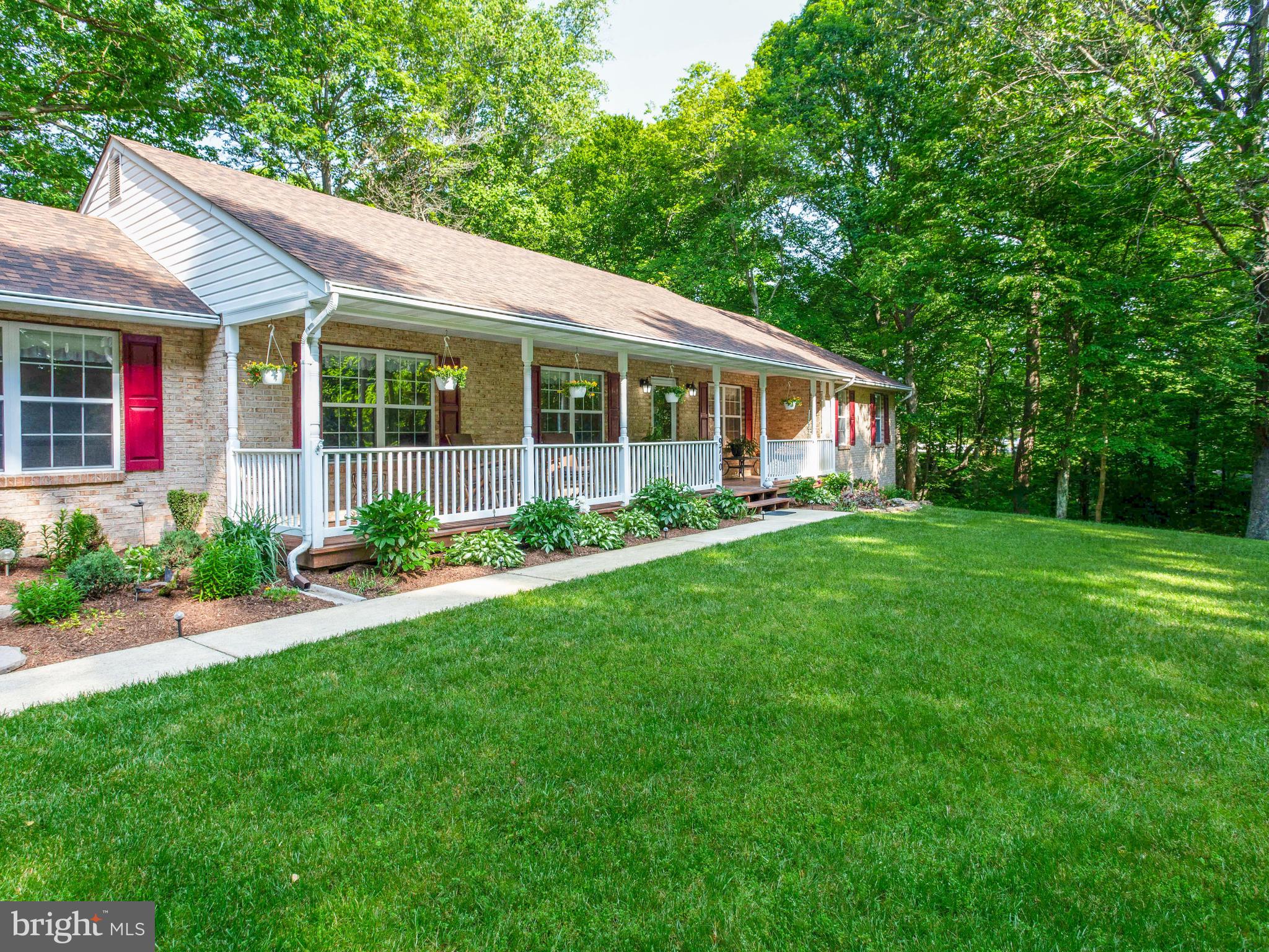 9710 Smith Way Dunkirk, MD 20754 - Photo 2 of 66 Covered front sitting area on tree lined lot