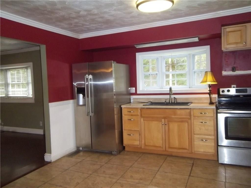 140 State Rte 1034 Templeton, PA 16259 - Photo 6 of 19 Kitchen with electric stove and refrigerator