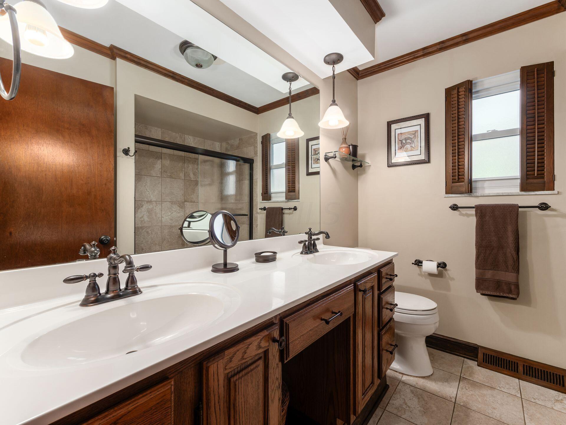 5577 Millington Road Columbus, OH 43235 - Photo 13 of 51 Main Bathroom - Updated, Dual Sinks, Tile Floor, Tiled Bath/Shower