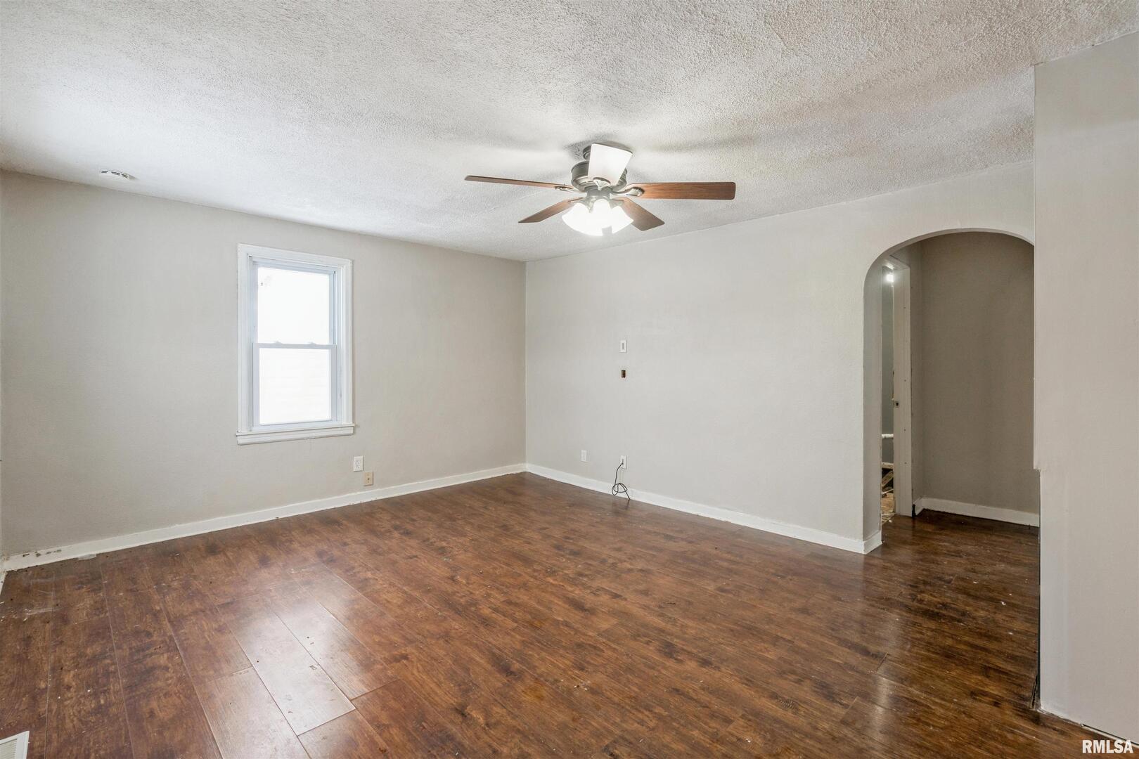 2207 4th Street Fulton, IL 61252 - Photo 4 of 11 wooden floor in an empty room with a window