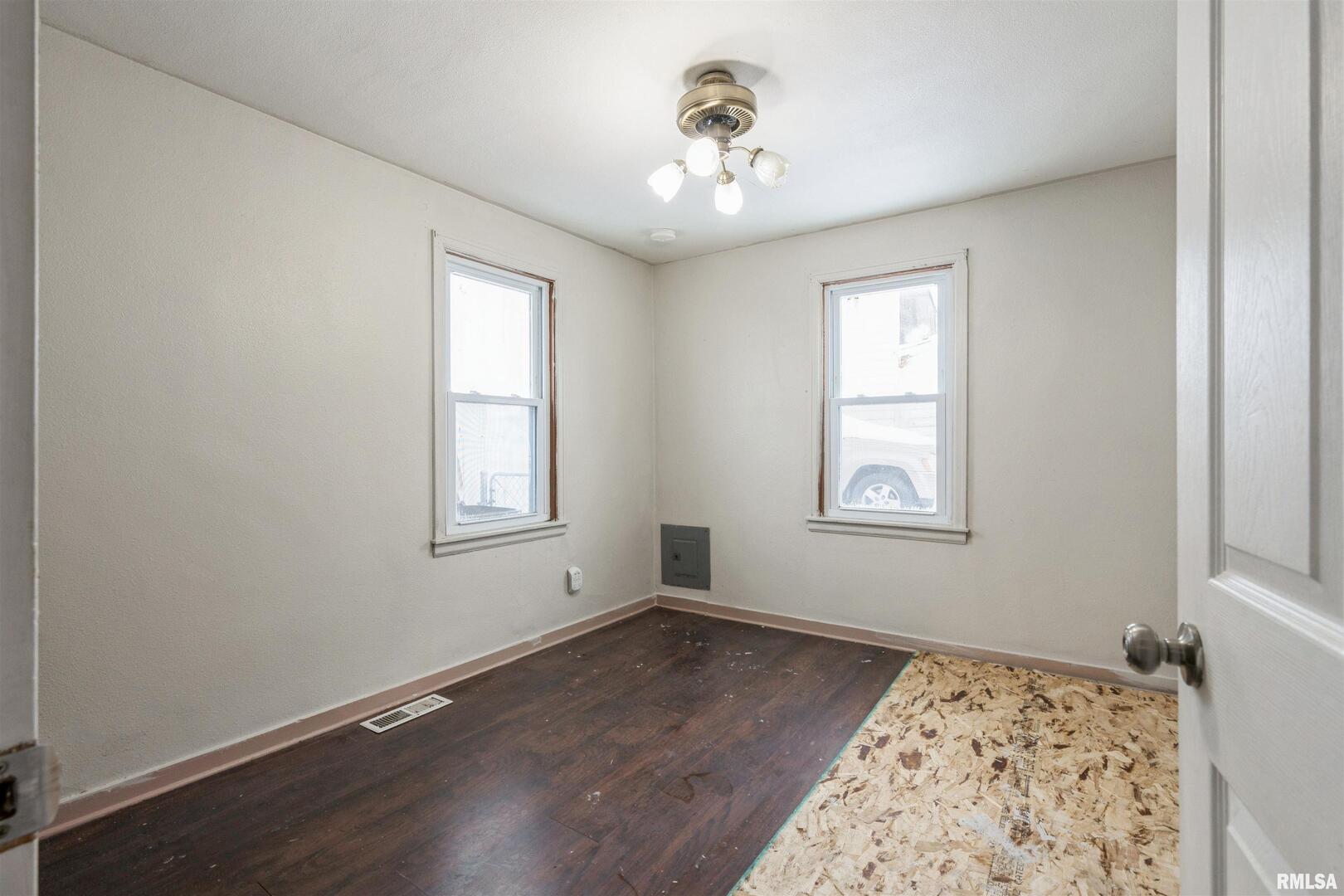 2207 4th Street Fulton, IL 61252 - Photo 7 of 11 wooden floor in an empty room with a window