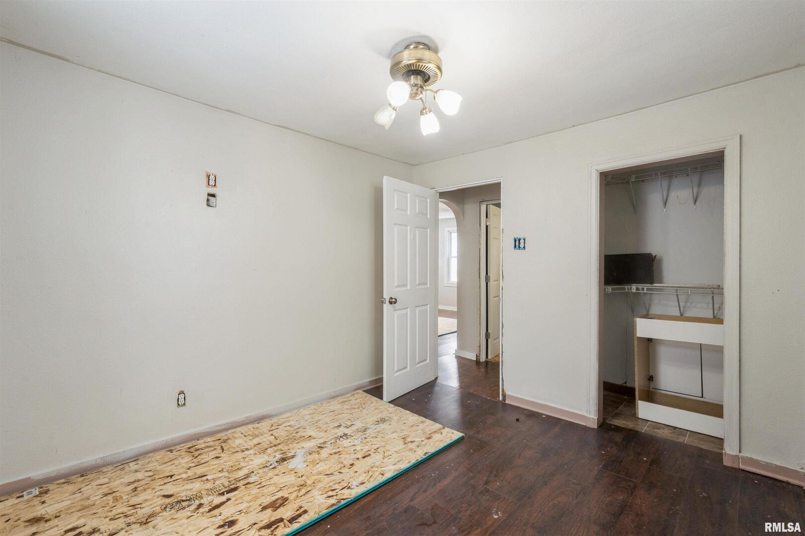 2207 4th Street Fulton, IL 61252 - Photo 8 of 11 a view of a livingroom with wooden floor and a kitchen space