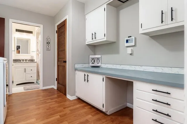 a kitchen with stainless steel appliances a refrigerator sink and cabinets