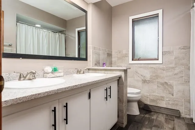 a kitchen with stainless steel appliances granite countertop a stove and a refrigerator
