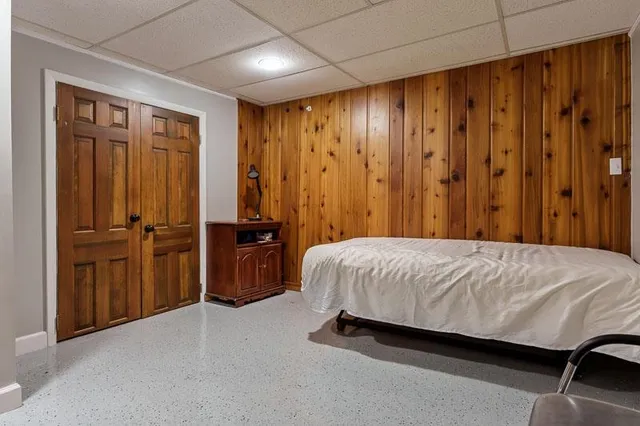 a bedroom with a bed and furniture