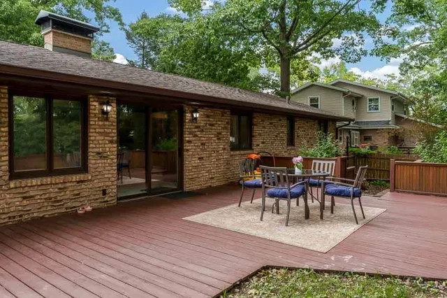 a view of a patio with table and chairs and potted plants