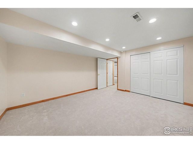 a living room with furniture and a gym