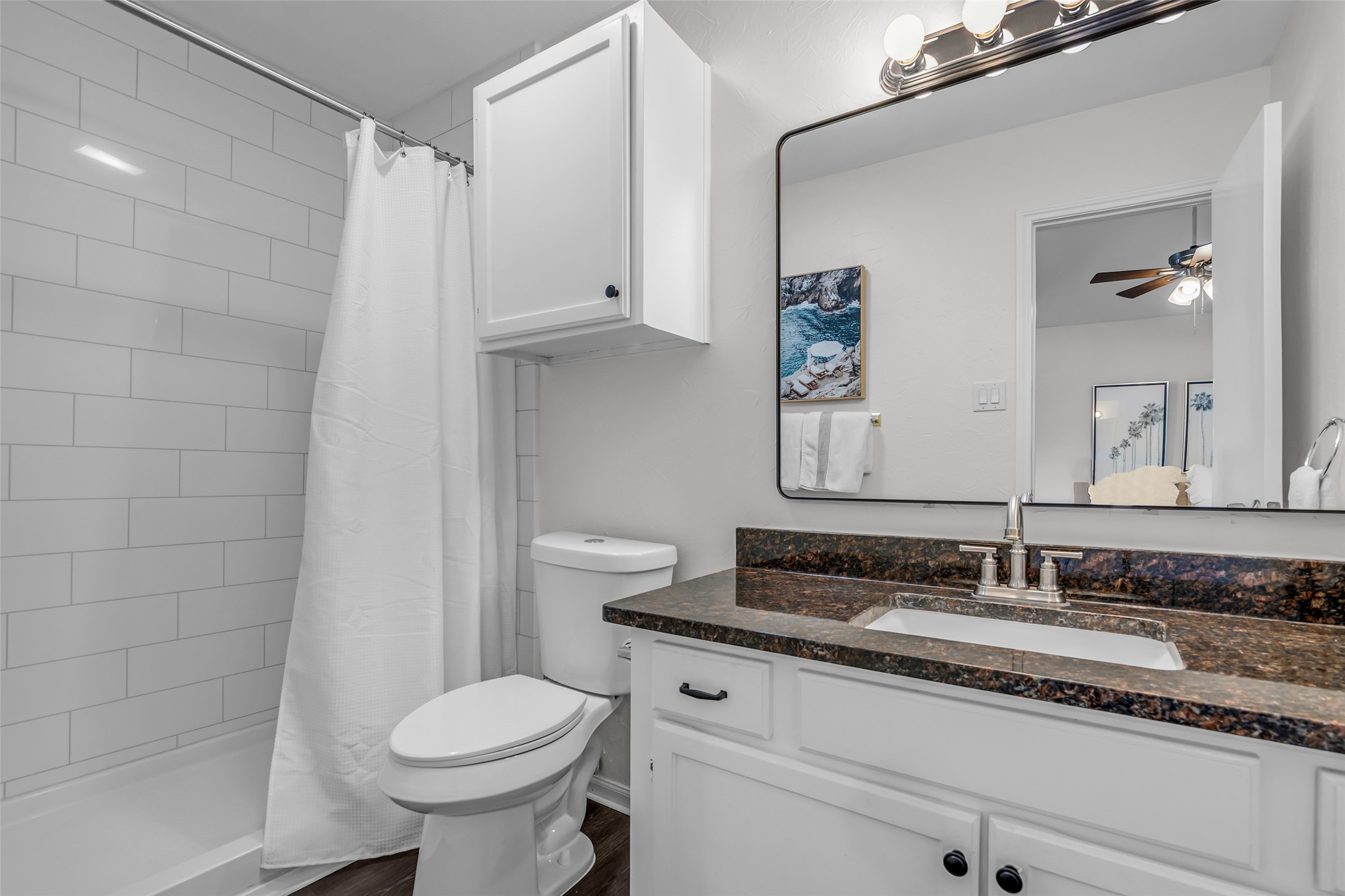 62 April Point Drive North Conroe, TX 77356 - Photo 20 of 25 a bathroom with a granite countertop sink toilet and shower