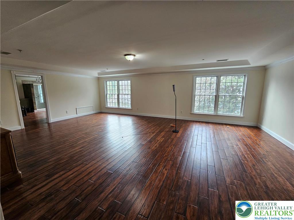 1 Dunminning Road Newtown Square, PA 19073 - Photo 13 of 30 an empty room with wooden floor and windows