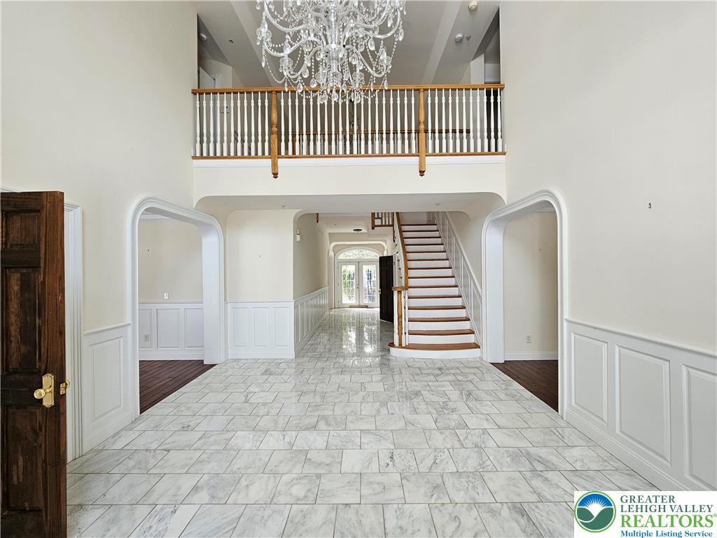 1 Dunminning Road Newtown Square, PA 19073 - Photo 2 of 30 a view of a hallway with entryway wooden floor and front door