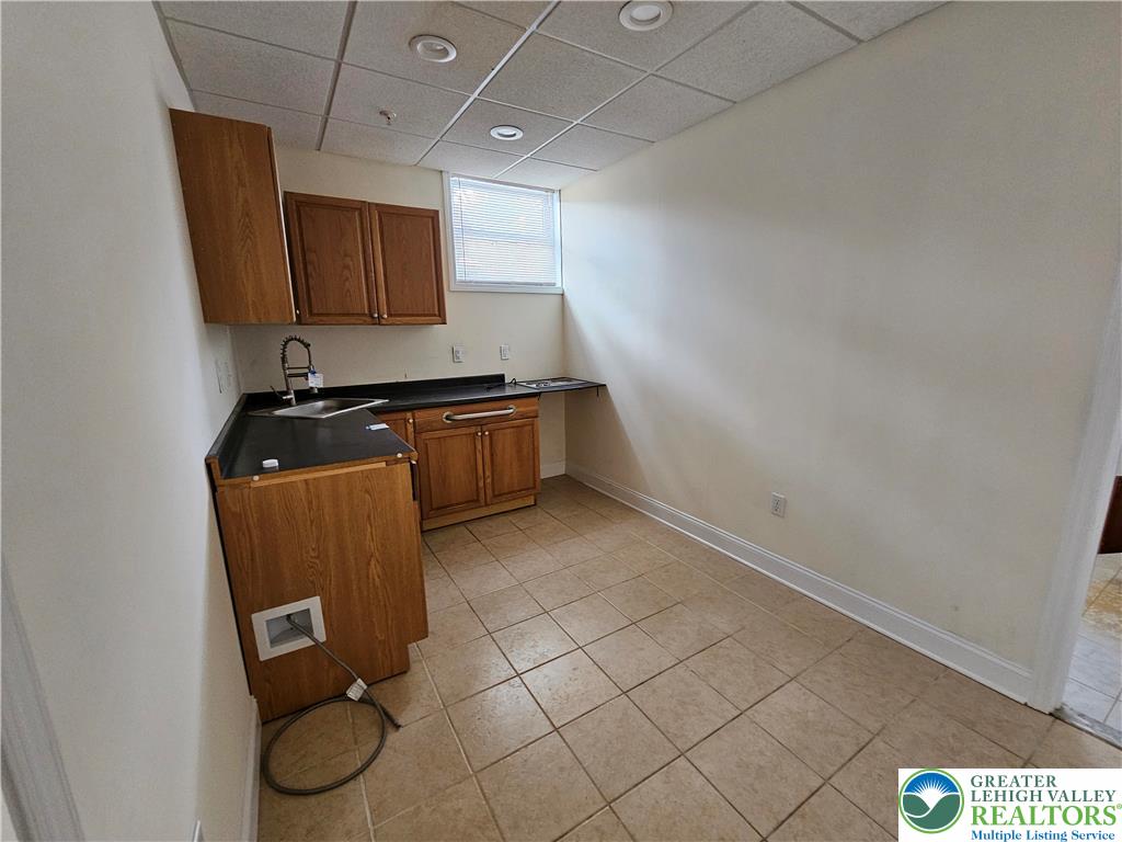 1 Dunminning Road Newtown Square, PA 19073 - Photo 24 of 30 a room with a sink and a mirror
