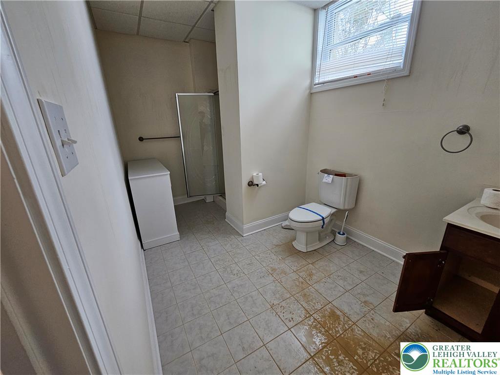 1 Dunminning Road Newtown Square, PA 19073 - Photo 25 of 30 a bathroom with a toilet and a vanity
