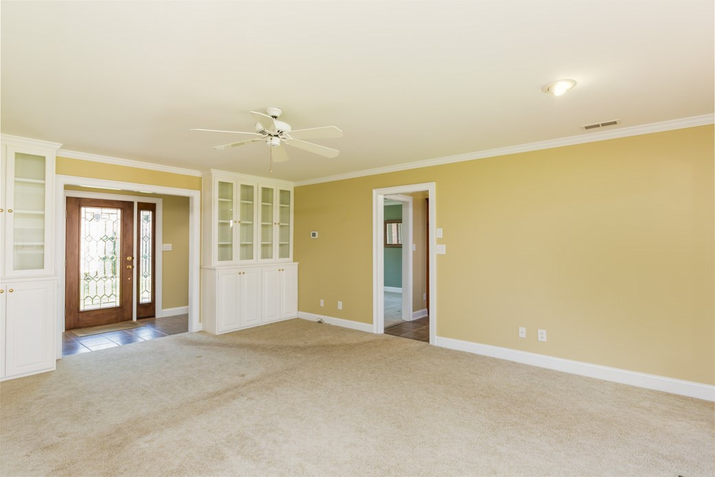 3120 Mt Vernon Church Road Raleigh, NC 27613 - Photo 9 of 9 Elegant family room with wide open floor plan connects to the kitchen. Custom BUILT IN CABINETS to store your special memories! Family Room