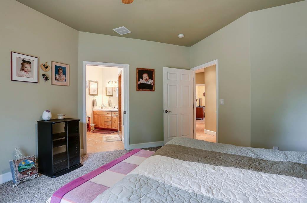 60031 Hopi Road Bend, OR 97702 - Photo 8 of 20 a bedroom with a bed and a window