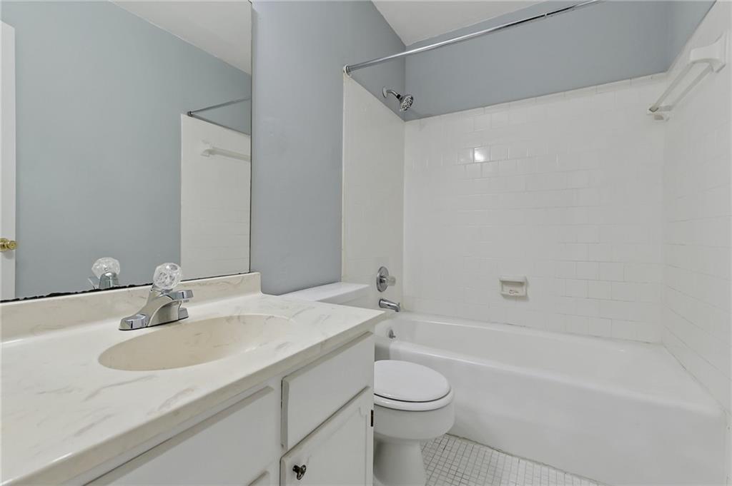 156 Glen Acres Court Decatur, GA 30035 - Photo 13 of 15 a bathroom with a sink and a mirror